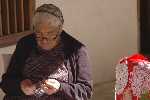 Scene in modos (woman making handicrafts)